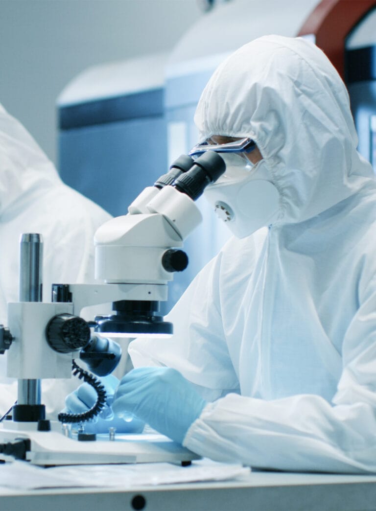 Personnel carrying out analysis in a cleanroom